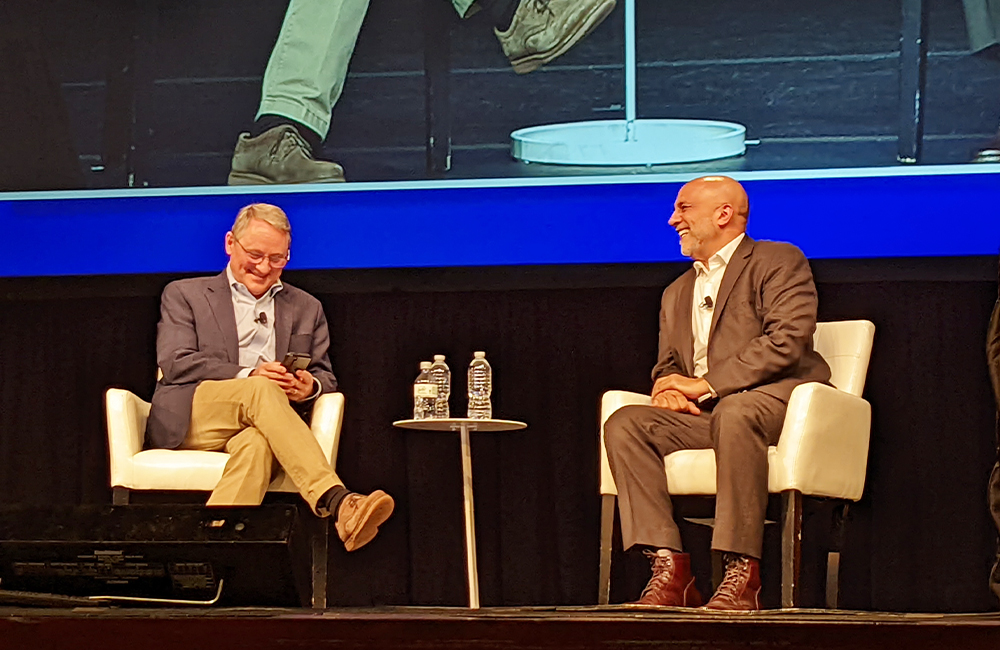 Two men have a discussion on stage at the HIMSS conference in Orlando, Florida