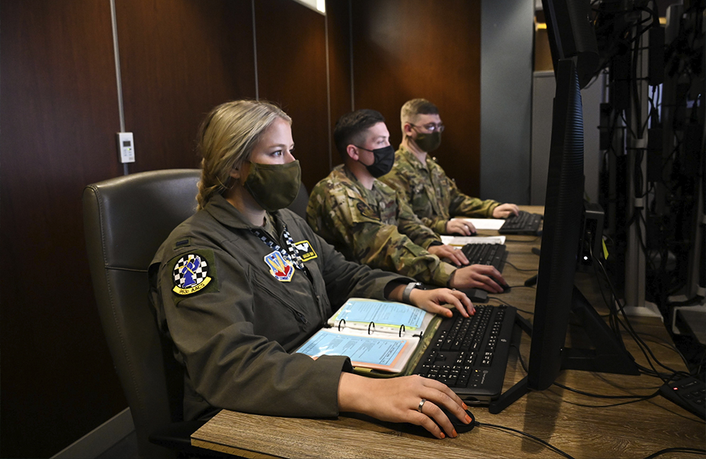 image of three air force operators using computers
