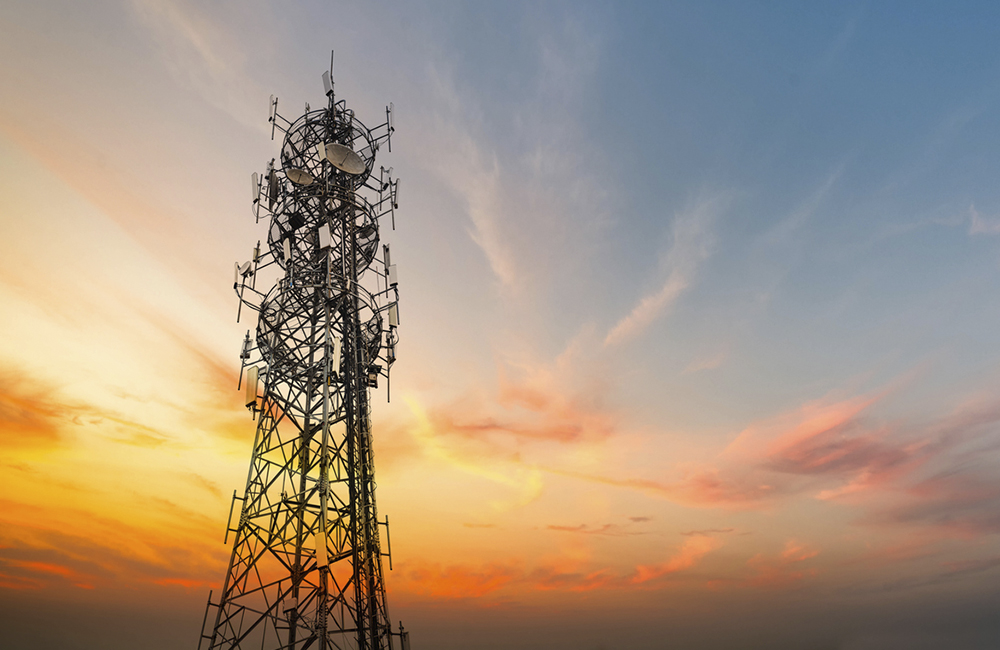 image of 5g tower against sunset