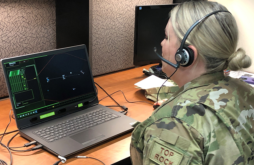image of U.S. Air Force Tech. Sgt. Alyssa Wier, weapons director assigned to the 176th Air Defense Squadron, Alaska Air National Guard tests the new Battle Management Training NEXT system at the Western Air Defense Sector Aug. 26, 2021, Joint Base Lewis-McChord, Washington.