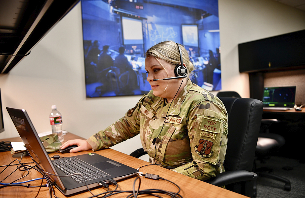 image of U.S. Air Force Tech. Sgt. Alyssa Wier, weapons director assigned to the 176th Air Defense Squadron, Alaska Air National Guard tests the new Battle Management Training NEXT system at the Western Air Defense Sector Aug. 26, 2021, Joint Base Lewis-McChord, Washington.