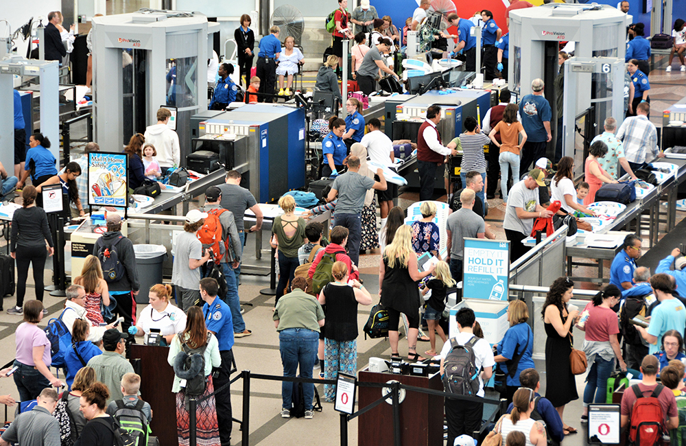 image of crowded tsa checkpoint at airport.