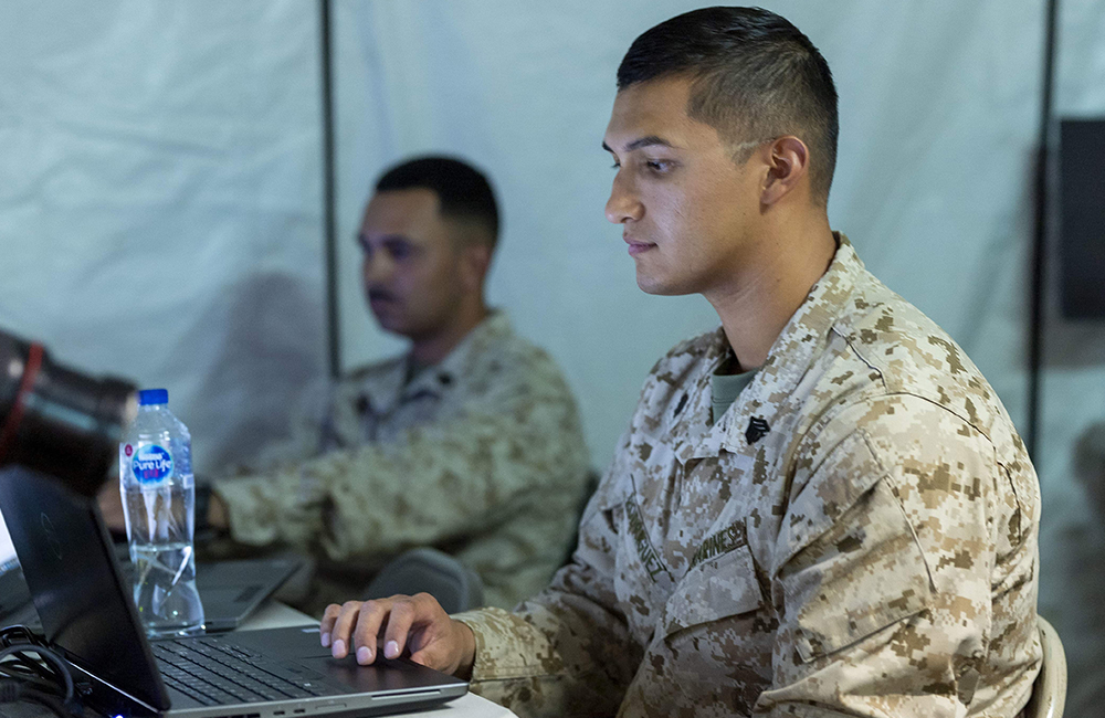 image of military personnel using laptop