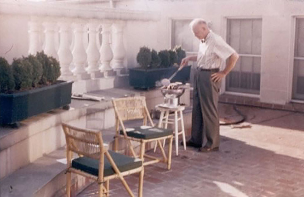 President Eisenhower cooking quail in the White House solarium.