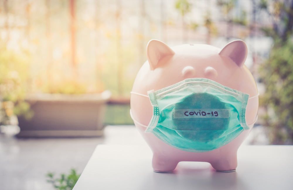 Piggy bank with Face Mask, Financial crisis and market crash due to virus spread.