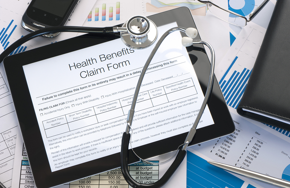 Online health benefits claim form with stethoscope