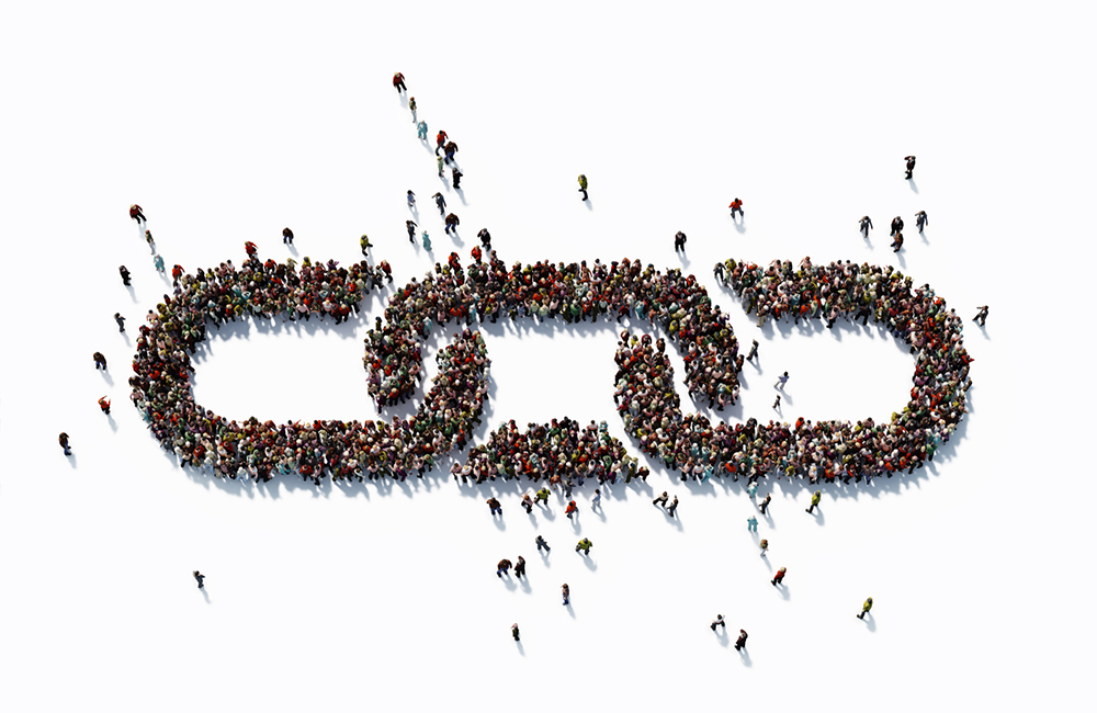 Human crowd forming a big chain symbol on white background. Horizontal composition with copy space. Clipping path is included. Bonding and social Media concept.