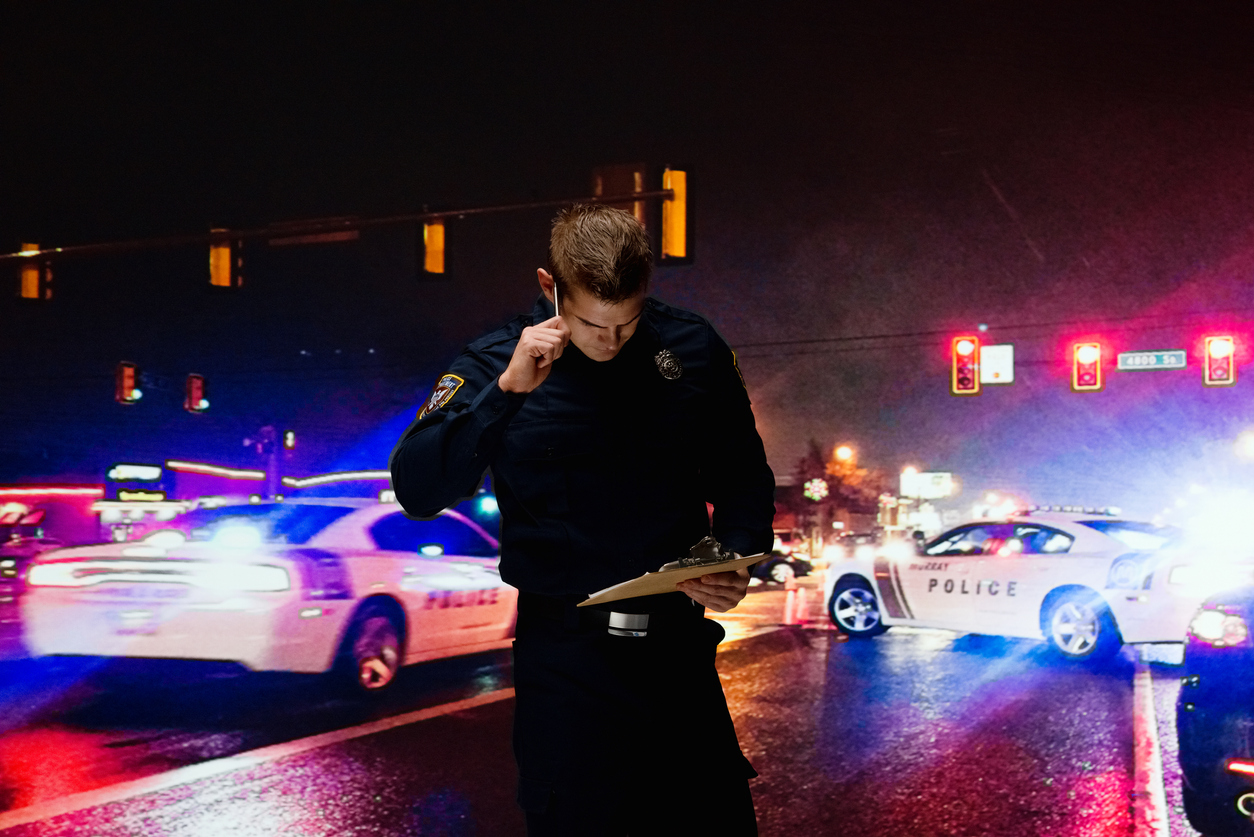 One person of with short hair caucasian young male security staff rescuing wearing uniform who is serious and holding clipboard and using mobile phone