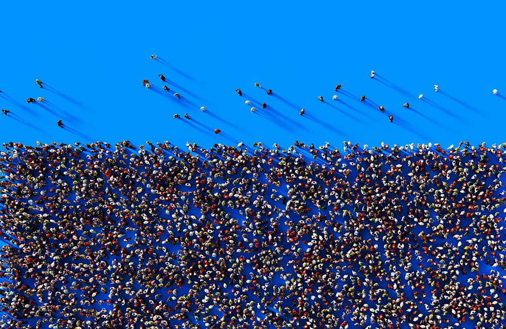 Human crowd forming a zone on blue background. Horizontal composition with clipping path and copy space.