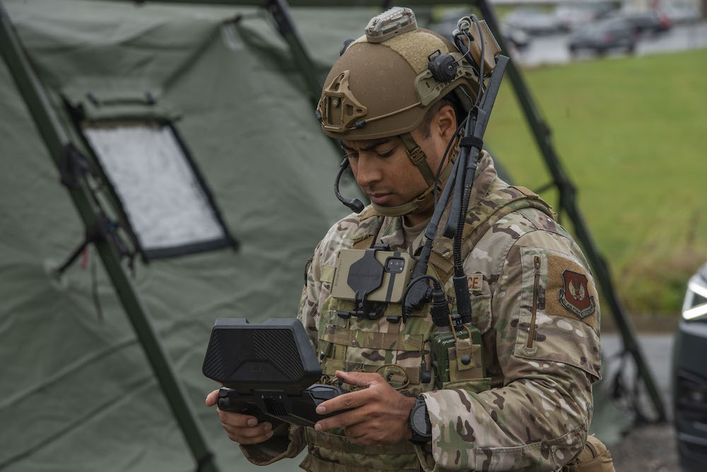 U.S. Airman prepares a small unmanned aircraft system for takeoff during a field training demonstration.