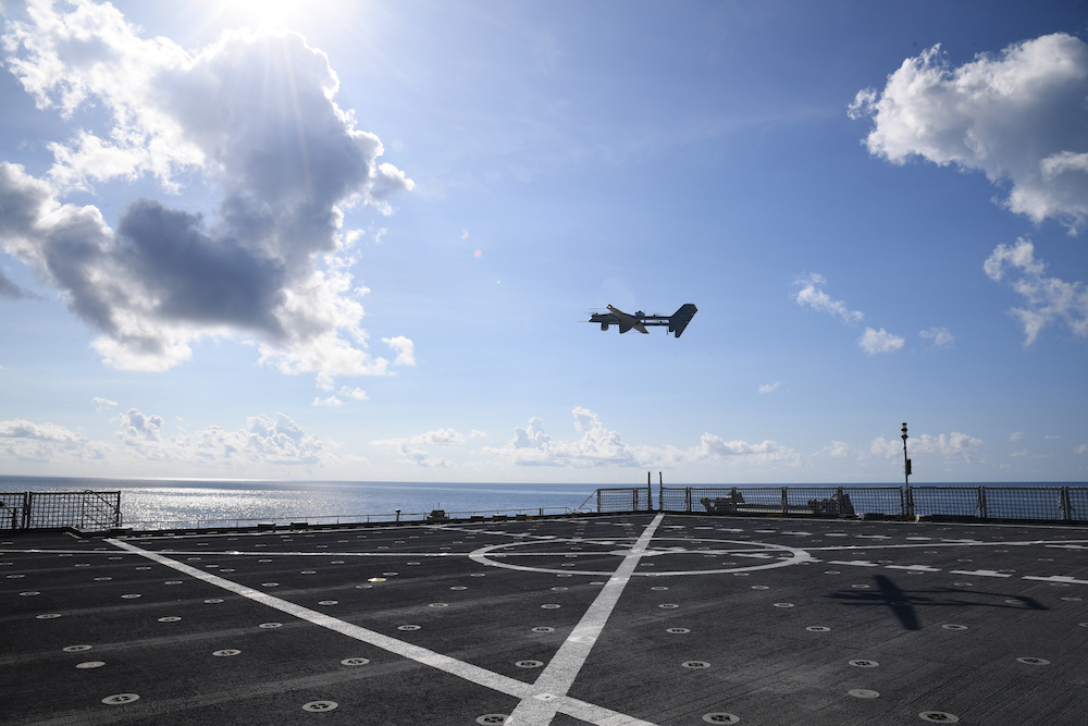 Technicians launch and recover an FVR-90 unmanned aircraft system from the flight deck of Spearhead-class expeditionary fast transport ship USNS Burlington during U.S. 4th Fleet’s Hybrid Fleet Campaign Event in the Atlantic Ocean October 7, 2023.