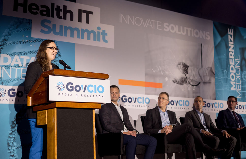 Centers for Medicare and Medicaid Services Chief Digital Strategy Officer Andrea Fletcher, speaks during the Health IT Summit in Bethesda, Maryland, Sept. 19, 2024, as officials from ARPA-H, ASPR, Datadog and IBM look on.