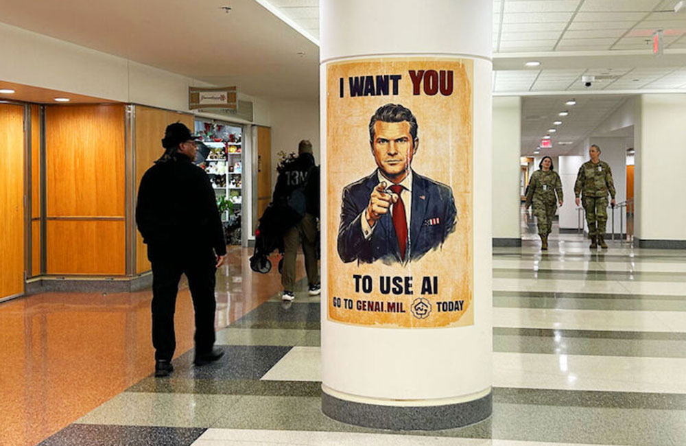 Employees walk past a GenAI.mil poster at the Pentagon on Dec. 12, 2025.