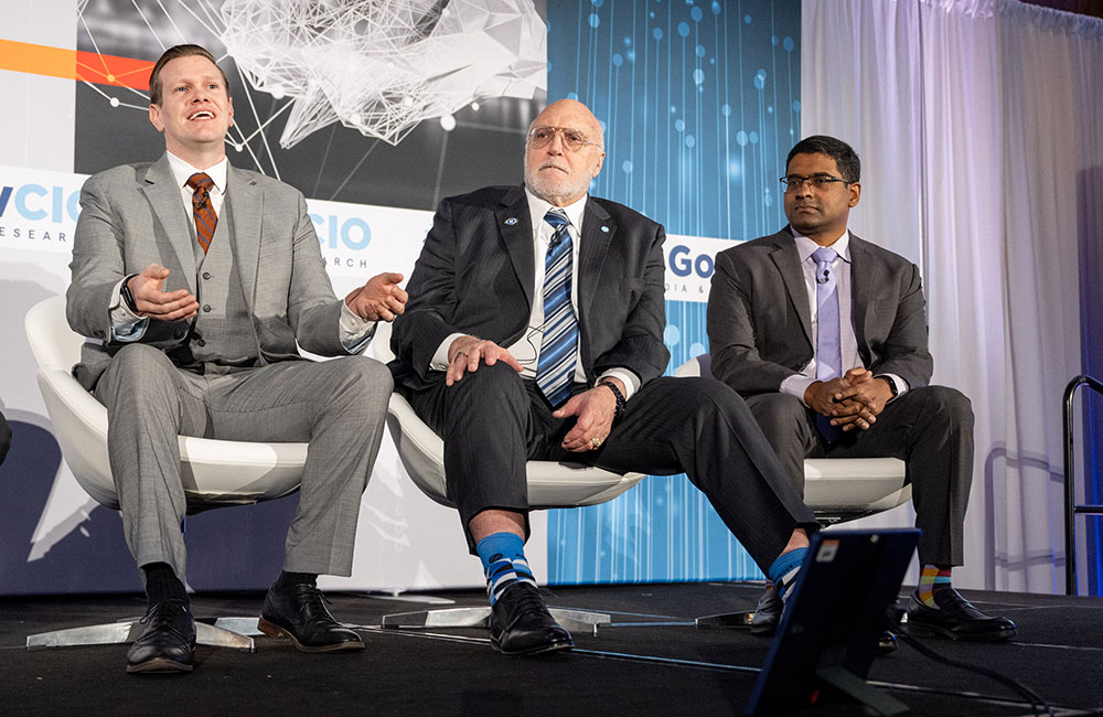 Idaho National Laboratory DevSecOps Lead Kevin Byrne, HP Federal CTO Tommy Gardner and Director of DHS S&T's Biometric and Identity Technology Center Arun Vemury speak at GovCIO Media & Research's AI Summit in Tysons, Virginia, on Jan. 9, 2025.