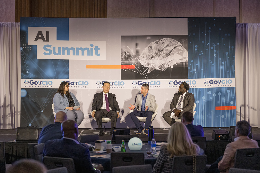 CISA CIO Bob Costello and DLA CIO Adarryl Roberts discuss AI workforce training at GovCIO Media & Research's AI Summit.