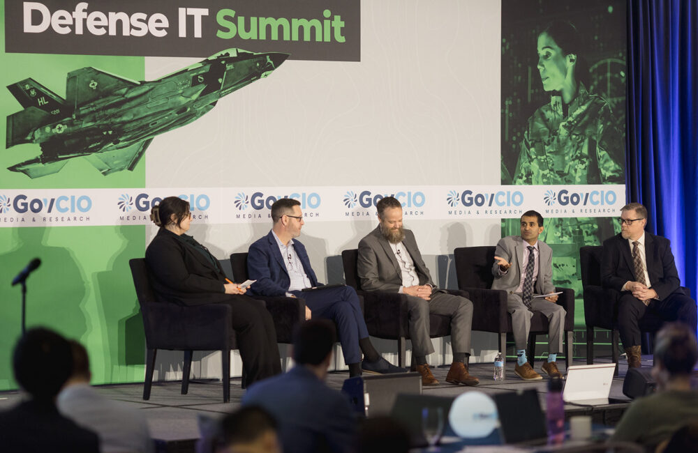 Cohesity's Marlin McFate, Marine Corps Community Services' Dave Raley, Navy Installations Command's Shery Thomas and Defense Health Management Systems' Chris Wallace speak at GovCIO Media & Research's Defense IT Summit on Feb. 26, 2026, in Arlington, Virginia.