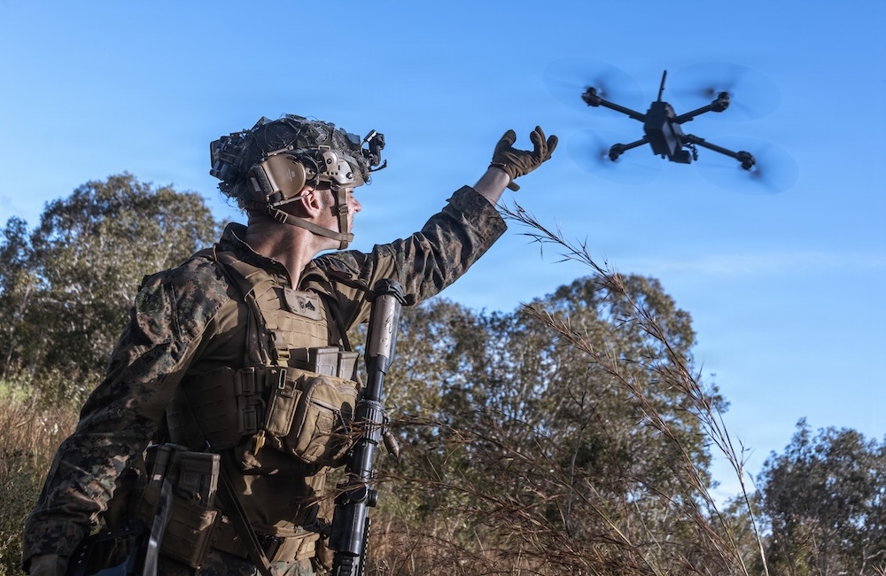 Cpl. Calvin Burke, an intelligence specialist with the 31st Marine Expeditionary Unit, activates a Skydio X2 small unmanned aerial system to survey the defensive line for opposing forces during a simulated assault and seizure at Glen Airfield, Queensland, Australia, July 2025.