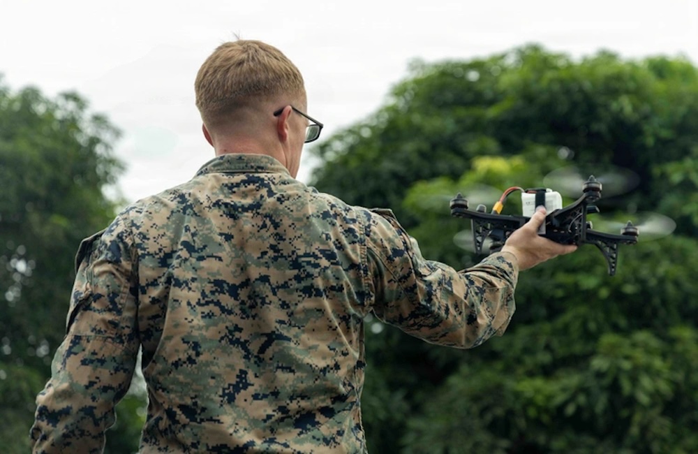 A U.S. Marine with Combat Logistics Battalion 8, Littoral Combat Force-24, holds a HANX drone in preparation to launch Sept. 16, 2026.